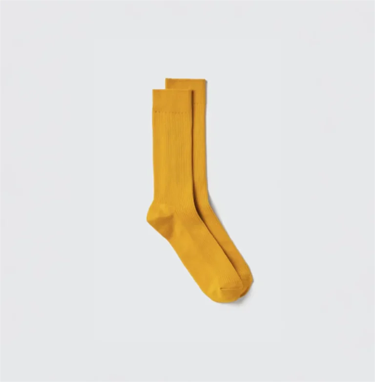 Yellow sock on white background