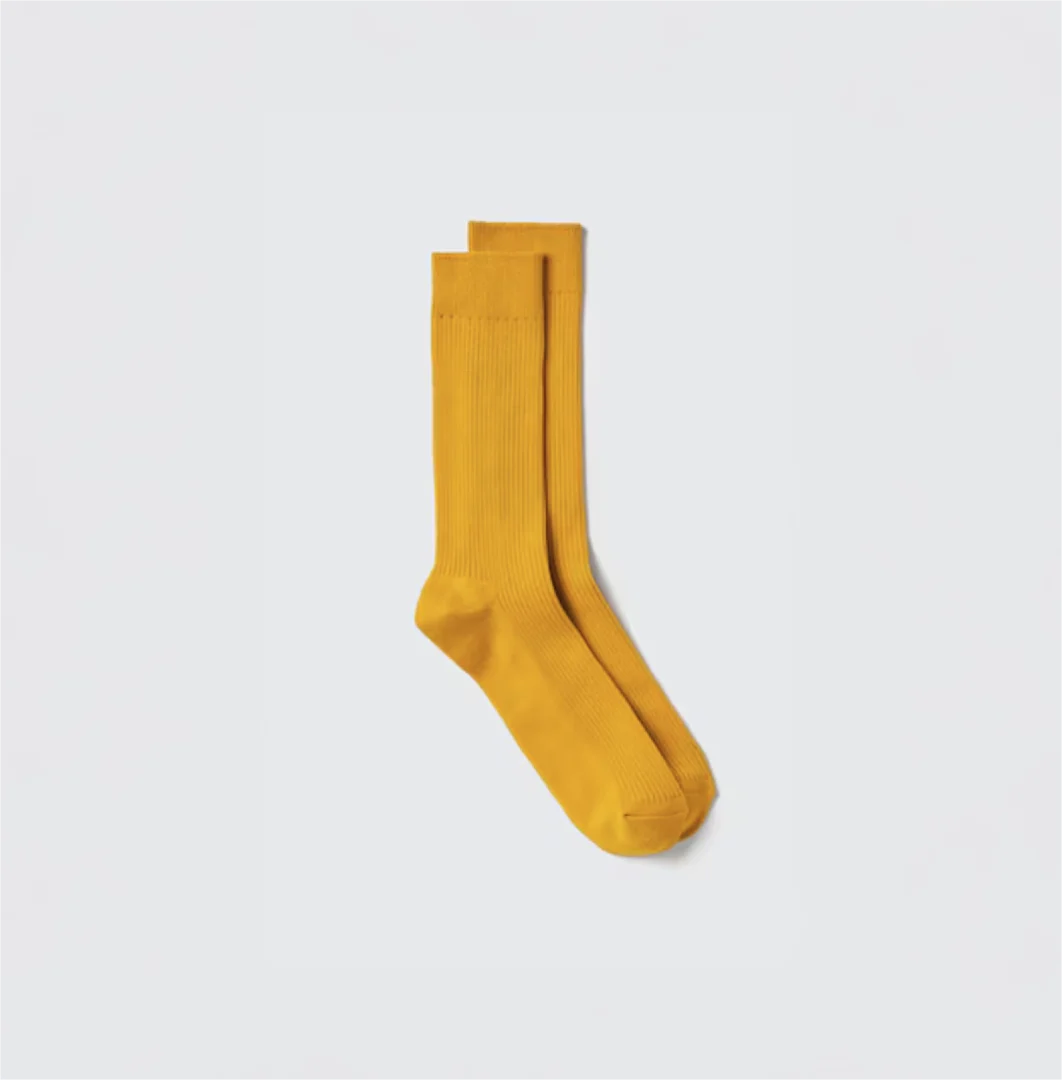 Yellow sock on white background
